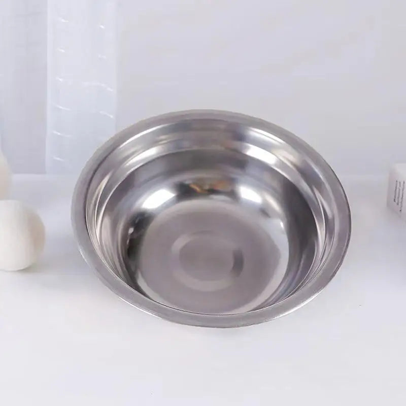 Elevated wooden pet bowl rack with 2 stainless steel bowls, tilted